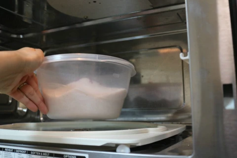 Place the flowers in the microwave to speed the drying process.